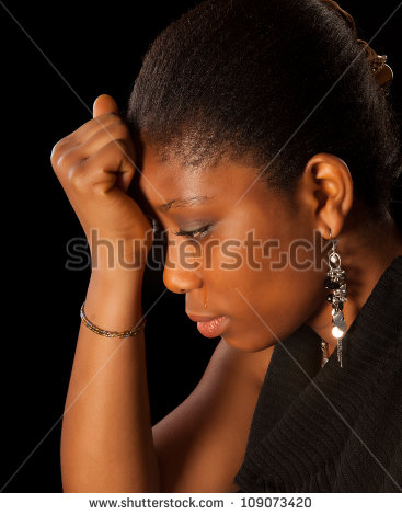 stock-photo-crying-young-african-ghanese-woman-against-a-black-background-109073420